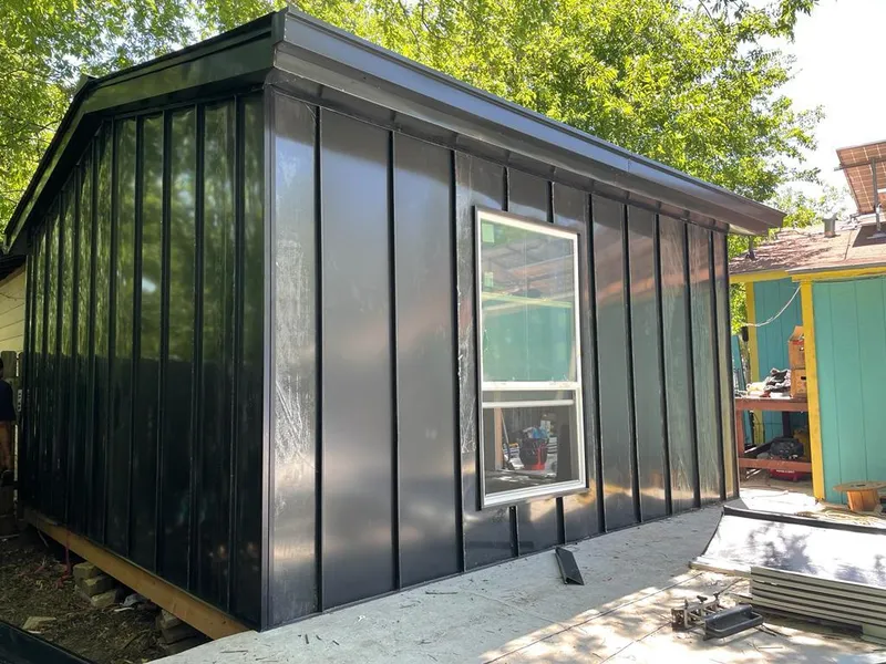 Black standing seam metal wall panels for Metal Roof Installation in Massena